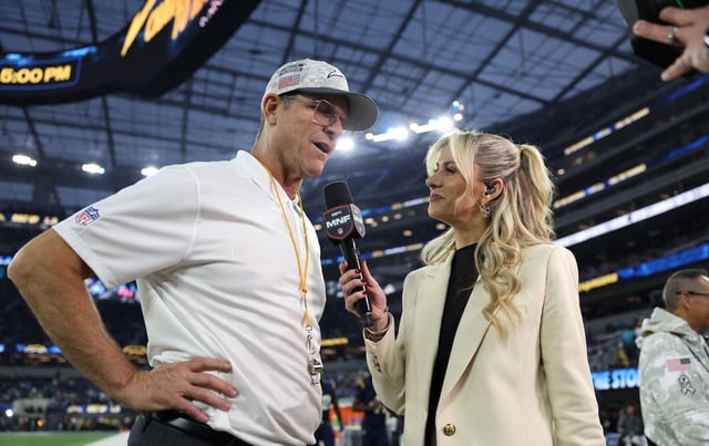Inglewood, CA - November 25, 2024 - SoFi Stadium: Head coach Jim Harbaugh of the Los Angeles Chargers and Laura Rutledge during Monday Night Football. (Photo by Brooke Sutton / ESPN Images)
