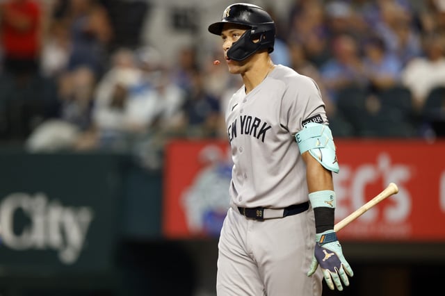 ARLINGTON, TX - AUGUST 6: Aaron Judge #99 of the New York Yankees reacts after a called third strike during the third inning against the Texas Rangers at Globe Life Field on August 6, 2025 in Arlington, Texas.