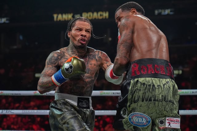 Gervonta Davis, left, punches Lamont Roach during the third round of a WBA lightweight championship boxing bout Saturday, March 1, 2025, in New York. (AP Photo/Frank Franklin II)