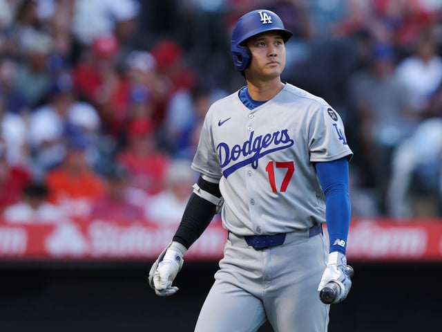 Los Angeles Dodgers designated hitter Shohei Ohtani looks on after striking out during the third inning of a baseball game against the Los Angeles Angels, Monday, Aug. 11, 2025, in Anaheim, Calif. (AP Photo/Jessie Alcheh)