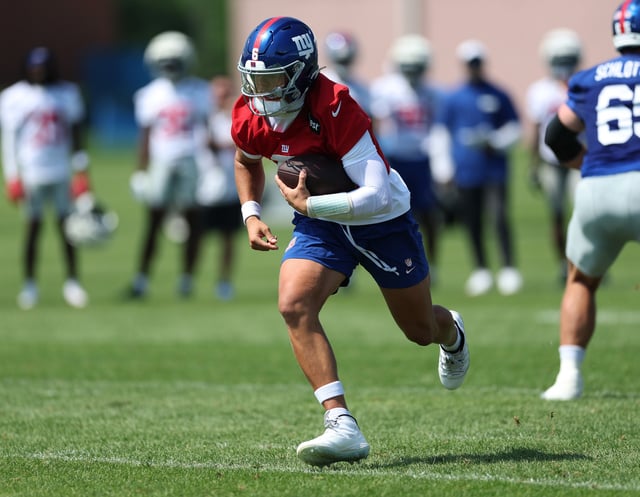Jaxson Dart #6 of the New York Giants runs with the ball during training camp at Quest Diagnostics Training Center on July 24, 2025 in East Rutherford, New Jersey.