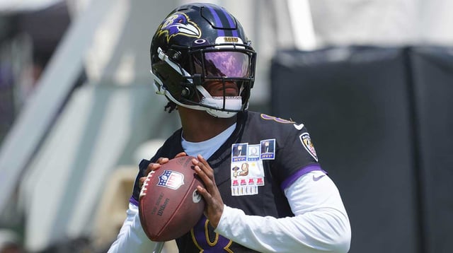 Jul 23, 2025; Owings Mills, MD, USA; Baltimore Ravens quarterback Lamar Jackson (8) warms up during training camp at Under Armour Performance Center.