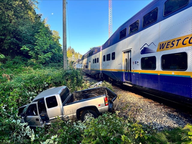This handout photo shows a West Coast Express commuter train and a pickup truck that collided in Port Moody, B.C., on Tuesday, Aug. 12, 2025. THE CANADIAN PRESS/Handout — Port Moody Police (Mandatory Credit)