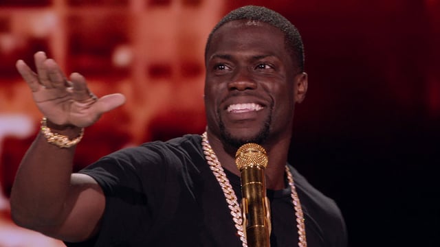 A person with a gold microphone