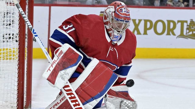 Apr 15, 2022; Montreal, Quebec, CAN; Montreal Canadiens goalie Carey Price (31) makes a save during the third period of the game against the New York Islanders at the Bell Centre. Mandatory Credit: Eric Bolte-Imagn Images