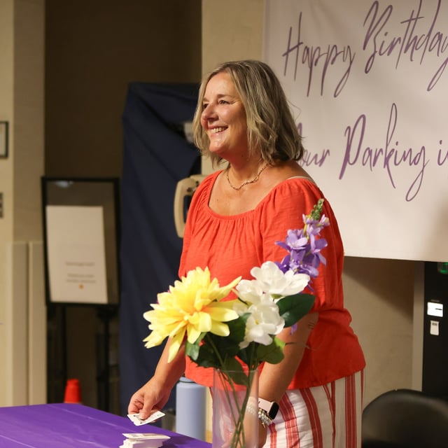 Cancer survivor Krystyna Locke celebrates her birthday by handing out parking passes in the A1 entrance of the Verspeeten Family Cancer Centre at London Health Sciences Foundation in London, Ont., on Tuesday, Aug. 12, 2025. THE CANADIAN PRESS/Nicole Osborne