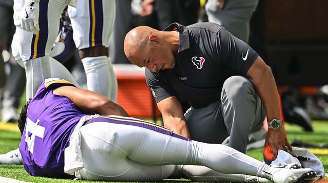Aug 9, 2025; Minneapolis, Minnesota, USA; Minnesota Vikings wide receiver Rondale Moore (4) is quickly attended to by a Houston Texans trainer after suffering a lower leg injury during the second quarter at U.S. Bank Stadium. Mandatory Credit: Jeffrey Becker-Imagn Images