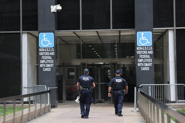 FILE - Members of the NYPD Strategic Response Group enter 26 Federal Plaza, where immigration court is located, June 8, 2025, in New York. (AP Photo/Heather Khalifa, File)