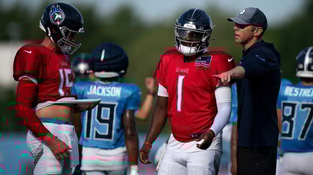 Tennessee Titans quarterback Cam Ward (1) works with quarterbacks coach Bo Hardegree during training camp at Ascension Saint Thomas Sports Park in Nashville, Tenn., Wednesday, July 30, 2025.