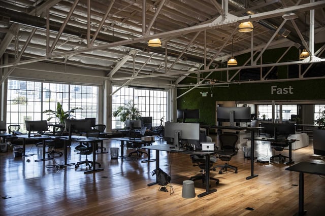 Socially-distanced office desks are seen at the Fast office in the SoMa neighborhood of San Francisco, in 2021.