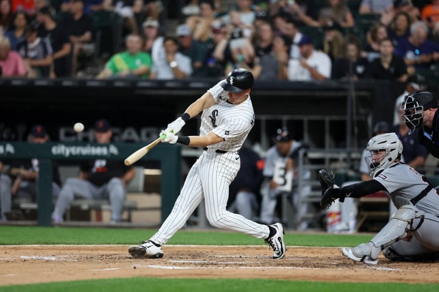 Chicago White Sox shortstop Colson Montgomery (12) hits a solo-homer during the fifth inning against the Detroit Tigers at Rate Field Monday Aug. 11, 2025, in Chicago. (Armando L. Sanchez/Chicago Tribune)