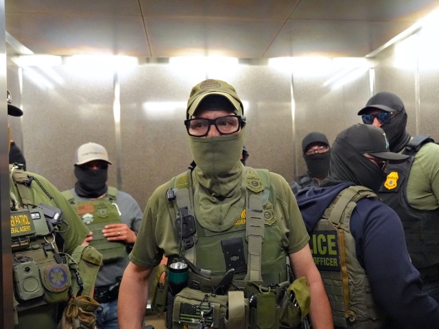 NEW YORK, UNITED STATES - JULY 21: Federal immigration agents are seen patrolling the corridors of the Jacob K. Javits Federal Building and prepare to detain an individual outside the immigration court in New York City, United States, on July 21, 2025. Several undocumented immigrants were reportedly detained inside the courthouse during ongoing immigration proceedings. (Photo by Selcuk Acar/Anadolu via Getty Images)