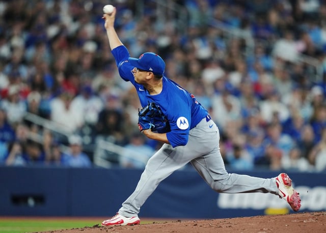 Chicago Cubs pitcher Javier Assad (72) works against the Toronto Blue Jays during first inning MLB baseball action in Toronto on Tuesday, Aug. 12, 2025. (Nathan Denette/The Canadian Press via AP)