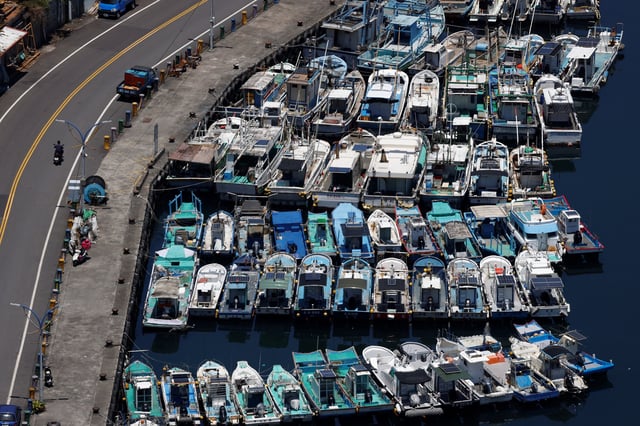 Fishing boats are docked inside a port, as Typhoon Podul approaches, in Yilan, Taiwan, August 12, 2025. REUTERS/Ann Wang