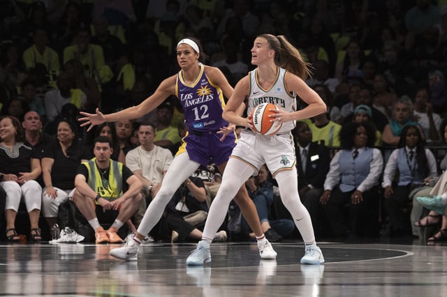 Sabrina Ionescu #20 of the New York Liberty looks to pass against Rae Burrell #12 of the Los Angeles Sparks at Barclays Center on July 26, 2025 in New York City.