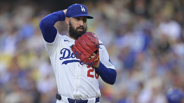 Jun 4, 2025; Los Angeles, California, USA; Los Angeles Dodgers pitcher Tony Gonsolin (26) reacts to hitting New York Mets shortstop Francisco Lindor (12) (not pictured) during the first inning at Dodger Stadium. Mandatory Credit: Jayne Kamin-Oncea-Imagn Images