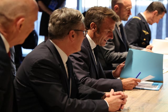 France's President Emmanuel Macron and Britain's Prime Minister Keir Starmer meet with Germany?s Chancellor Friedrich Merz (not pictured) on the sidelines of the two-day NATO's Heads of State and Government summit, in The Hague, Netherlands June 24, 2025. Ludovic Marin/Pool via REUTERS/File Photo