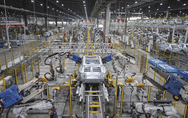 FILE - A car frame is being welded by robots at a Vinfast factory in Hai Phong, Vietnam on Sept. 29, 2023. (AP Photo/Hau Dinh, File)