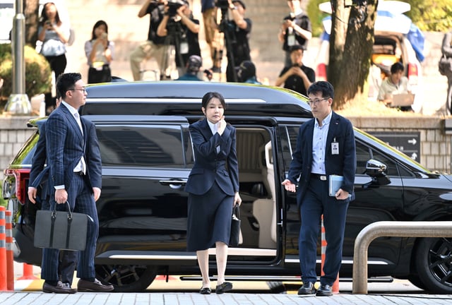 South Korea's former first lady Kim Keon Hee, wife of impeached former president Yoon Suk Yeol, arrives at a court to attend a hearing to review her arrest warrant requested by special prosecutors at the Seoul Central District Court, in Seoul, South Korea August 12, 2025.     JUNG YEON-JE/Pool via REUTERS/File Photo