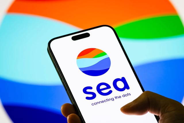 A photo illustration displaying the logo of the Singaporean tech firm Sea&#39;s logo on a smartphone.