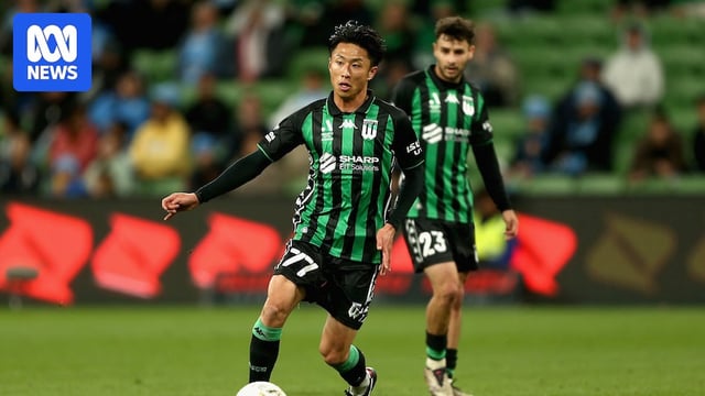 Western United player Riku Danzaki controls the ball while a teammate looks on.