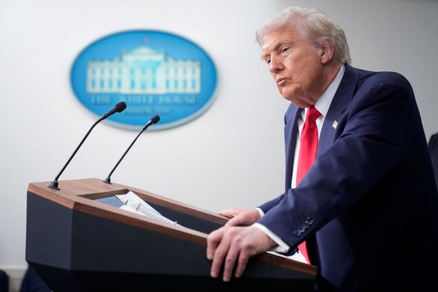 President Donald Trump listens to a question from a reporter in the James Brady Press Briefing Room at the White House on August 11 in Washington, DC.