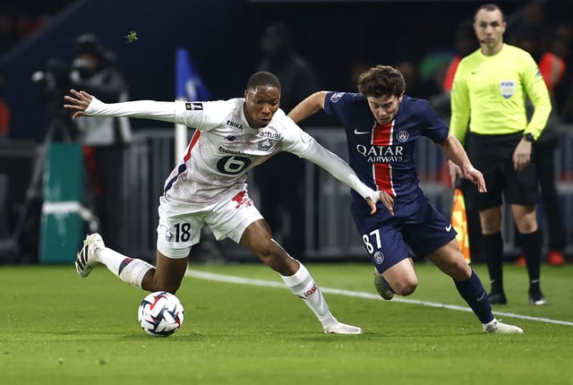 Soccer Football - Ligue 1 - Paris St Germain v Lille - Parc des Princes, Paris, France - March 1, 2025 Lille's Bafode Diakite in action with Paris St Germain's Joao Neves REUTERS/Abdul Saboor/File Photo
