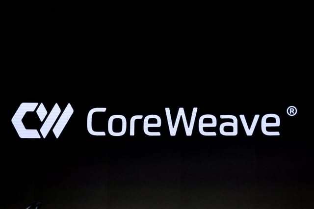 A screen displays the company logo for CoreWeave, Inc., Nvidia-backed cloud services provider, during the company's IPO at the Nasdaq Market, in New York City, U.S., March 28, 2025. REUTERS/Brendan McDermid/File Photo