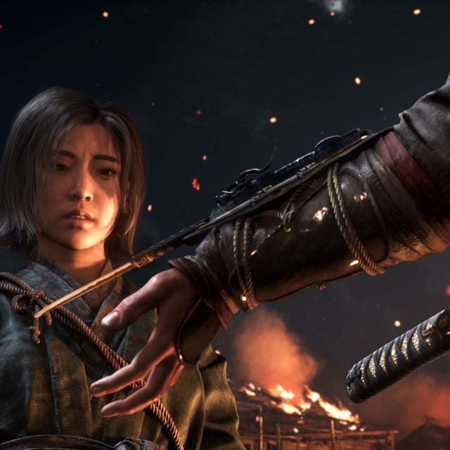 Naoe looking at the wrist blade in Assassin's Creed Shadows