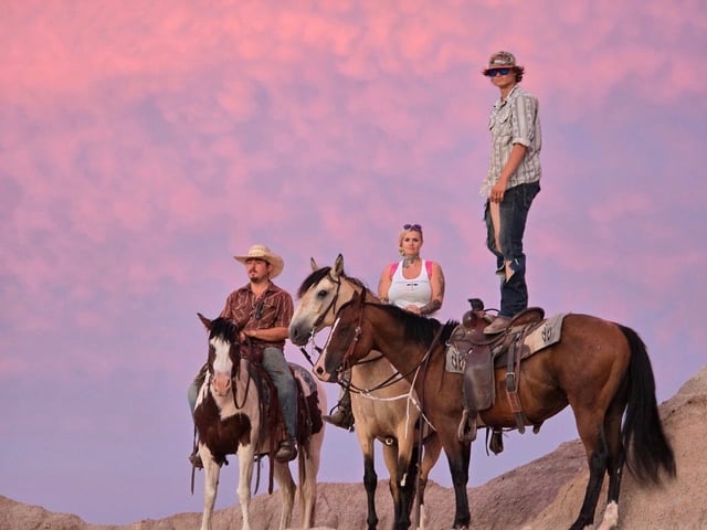 Tabatha Zimiga rides with her boyfriend Clay (left) and her son Chevy Zimiga. Tabatha stars as herself in the upcoming debut feature film, "East of Wall," written and directed by Kate Beecroft and premiering Aug. 15 nationwide.