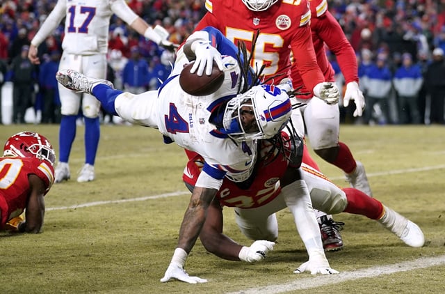Jan 26, 2025; Kansas City, MO, USA; Buffalo Bills running back James Cook (4) dives for a touchdown against the Kansas City Chiefs during the second half in the AFC Championship game at GEHA Field at Arrowhead Stadium. Mandatory Credit: Denny Medley-Imagn Images/File Photo