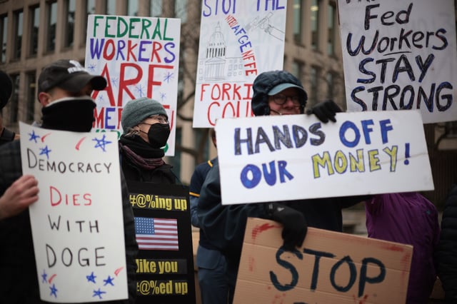 Protesters rally outside of the Theodore Roosevelt Federal Building headquarters of the U.S. Office of Personnel Management on February 05, 2025 in Washington, DC. The group of federal employees and supporters are protesting against Elon Musk, tech billionaire and head of the Department of Government Efficiency (DOGE), and his aids who have been given access to federal employee personal data and have allegedly locked out career civil servants from the OPM computer systems.