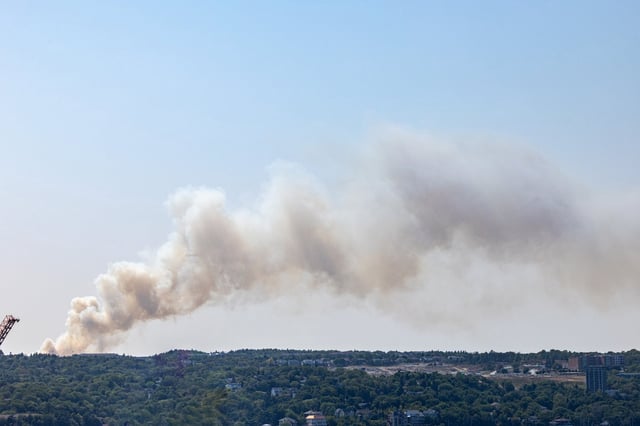 A large billow of smoke from a wildfire near the Susies Lake Area of Halifax is seen, on Tuesday, Aug. 12, 2025. THE CANADIAN PRESS/Kelly Clark