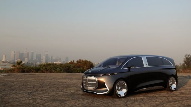 A mercedes concept van parked with LA in the distance on a very smoky day.