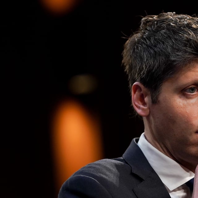 Sam Altman, CEO of OpenAI looking pensive off-camera
