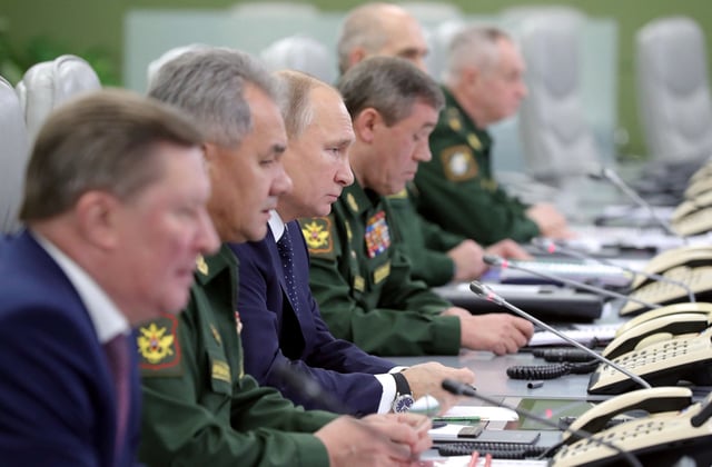 Russia's President Vladimir Putin (3rd L) visits the National Defence Control Centre (NDCC) to oversee the test of a new Russian hypersonic missile system called Avangard, which can carry nuclear and conventional warheads, in Moscow, Russia December 26, 2018. Sputnik/Mikhail Klimentyev/Kremlin via REUTERS/File Photo