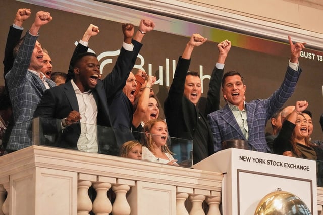 Bullish CEO Tom Farley, right, leads a cheer during opening bell ceremonies of the New York Stock Exchange, Wednesday, Aug. 13, 2025. (AP Photo/Richard Drew)
