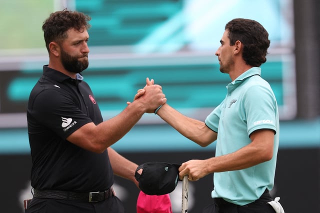 Jun 8, 2025; Gainesville, Virginia, USA; Jon Rahm (L) of team Legion XIII shakes hands with Joaquin Niemann (R) of team Torque GC on the eighteenth green after finishing the final round of the LIV Golf Virginia golf tournament at Robert Trent Jones Golf Club. Mandatory Credit: Geoff Burke-Imagn Images/File Photo