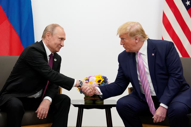 Russia's President Vladimir Putin and U.S. President Donald Trump shake hands during a bilateral meeting at the G20 leaders summit in Osaka, Japan, June 28, 2019.  REUTERS/Kevin Lamarque/File Photo