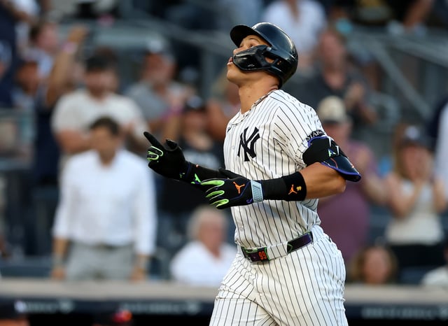 NEW YORK, NEW YORK - AUGUST 12: Aaron Judge #99 of the New York Yankees reacts after hitting a solo home run in the first inning against the Minnesota Twins at Yankee Stadium on August 12, 2025 in the Bronx borough of New York City. (Photo by Elsa/Getty Images)