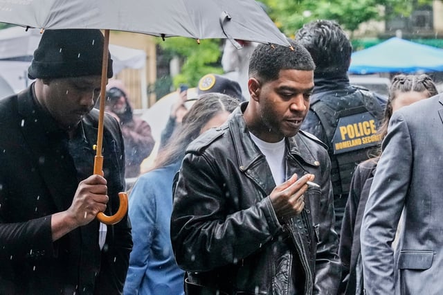 Rapper Kid Cudi, right, arrives at Federal Court for the trial of Sean "Diddy" Combs, in New York, on May 22, 2025.