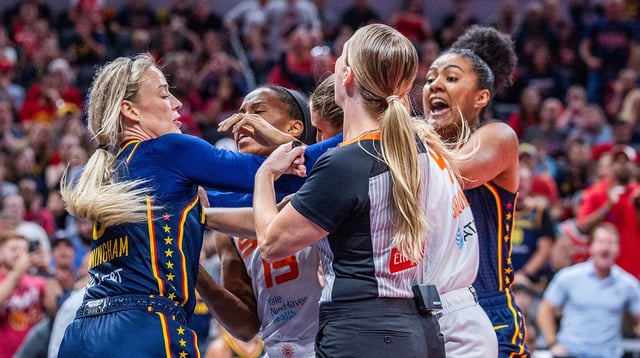 Jun 17, 2025; Indianapolis, Indiana, USA; Indiana Fever guard Sophie Cunningham (8) and Connecticut Sun guard Jacy Sheldon (4) get into a fight in the second half at Gainbridge Fieldhouse. Mandatory Credit: Trevor Ruszkowski-Imagn Images.