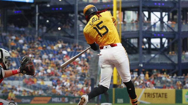 Aug 8, 2025; Pittsburgh, Pennsylvania, USA; Pittsburgh Pirates center fielder Oneil Cruz (15) hits an RBI double against the Cincinnati Reds during the fourth inning at PNC Park.