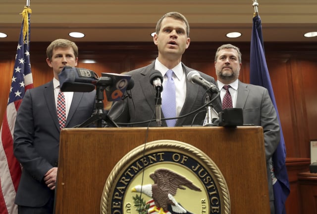 Former U.S. Attorney Thomas Cullen, center, now a Donald Trump-appointed U.S. district judge, speaks with the media in Charlottesville Federal Court in Charlottesville, Va, March 27, 2019.