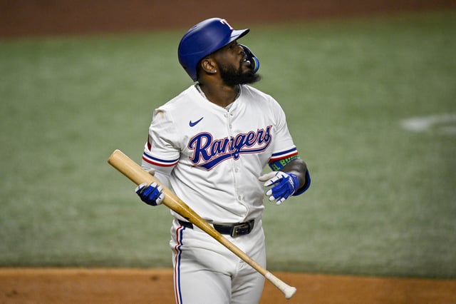 Aug 11, 2025; Arlington, Texas, USA; Texas Rangers right fielder Adolis Garcia (53) reacts to striking out against the Arizona Diamondbacks during the second inning at Globe Life Field. Mandatory Credit: Jerome Miron-Imagn Images