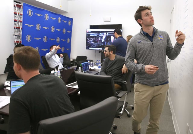 First picks from the Warriors’ Gaming Squad including general manager for the Santa Cruz Warriors Kent Lacob (right) being made at the Warriors offices in downtown Oakland as they watched the proceedings on a screen on Wednesday, April 4, 2018, in Oakland, Calif.