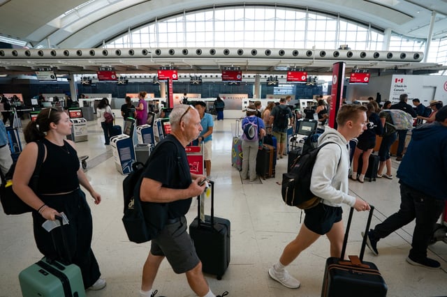 The Air Canada check-in area inside Terminal 1 of Toronto Pearson International Airport is pictured in Mississauga, Ont., on Wednesday, August 13 2025. THE CANADIAN PRESS/Arlyn McAdorey