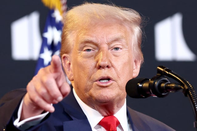 U.S. President Donald Trump takes a question from the press during a visit to the Kennedy Center in Washington, D.C., U.S., August 13, 2025.  REUTERS/Kevin Lamarque