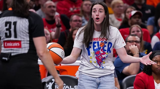 Indiana Fever guard Caitlin Clark (22) reacts to a call from the referee Tuesday, Aug. 12, 2025, during the game at Gainbridge Fieldhouse in Indianapolis. The Dallas Wings defeated the Indiana Fever, 81-80.