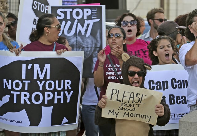 Protestors become vocal the day before a planned Florida Fish and Wildlife Conservation Commission bear hunt at a rally in Lake Eola Park in downtown Orlando, Fla., Oct. 23, 2015.
